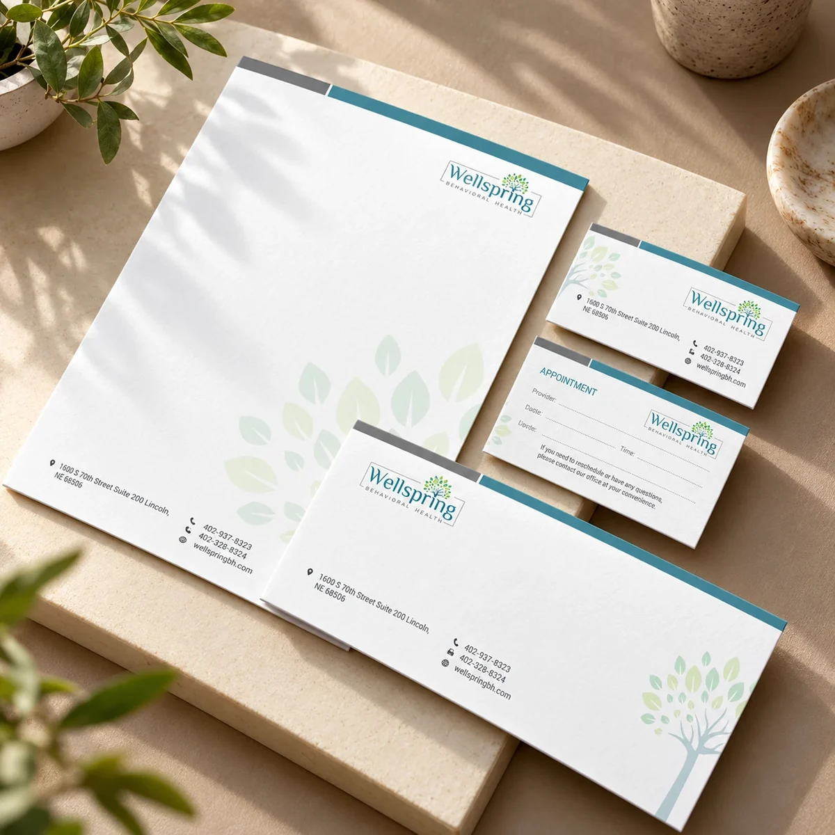 Wellspring coordinated letterhead, envelope and business card suite